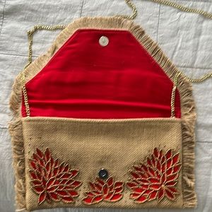 Raffia clutch with red lotus design